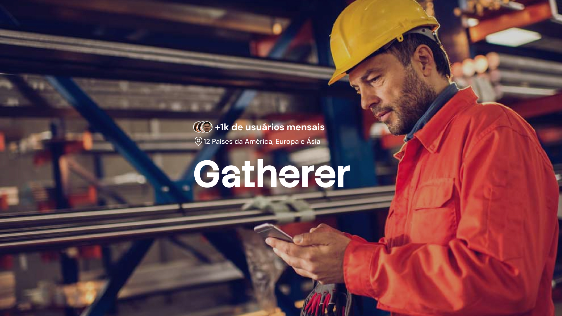 Industrial worker surronded by steel checking his phone